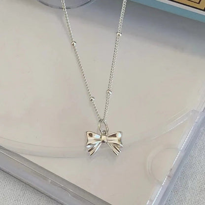 Charming Ribbon Bow Pendant Necklace - Hidden Forever